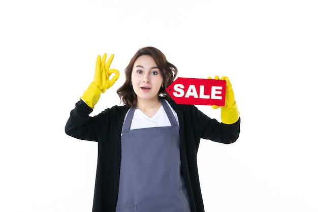 front view young female holding red sale writing on white background garden flower leaves job grass gardener nature shopping