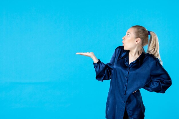 front view young female in pajamas on blue background night color yawn bed party rest dream nightmare sleep tired woman