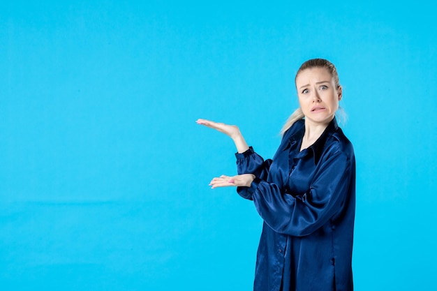 front view young female in pajamas on blue background night color yawn bed party rest dreams nightmare sleep tired woman