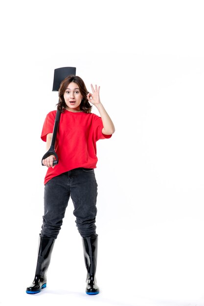 front view young female in red shirt holding black shovel on white background soil work woman ground nature emotion cemetery