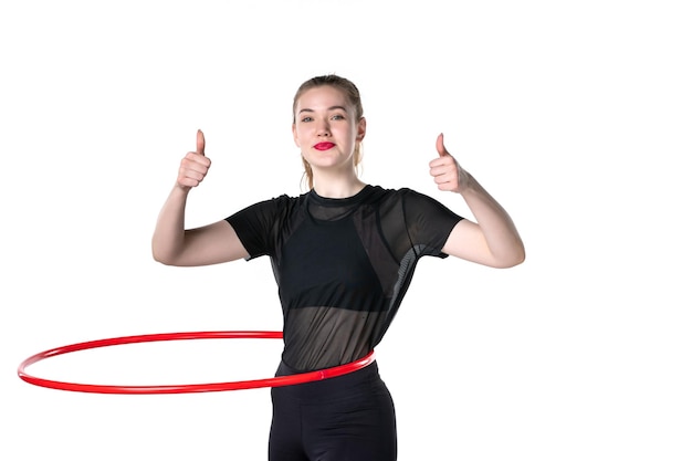 front view young female working with red hula hoop on white background color lifestyle athlete woman health body yoga sport