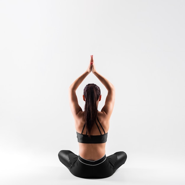 Front view young female in yoga pose