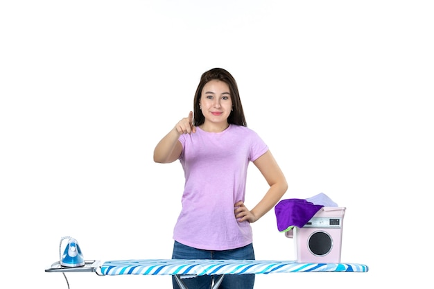 front view young housewife with clothes and ironing board on white background color work dry clean woman laundry emotion