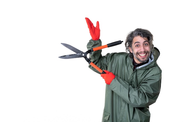 Front view young male holding garden secateurs on white background plant flower emotions tree grass soil work gardener job