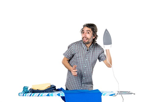 front view young male holding iron on white background machine man housework work clothes clean home