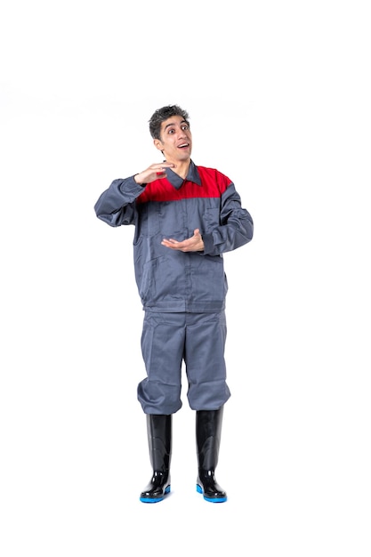 Front view young male in special uniform talking to someone on white surface