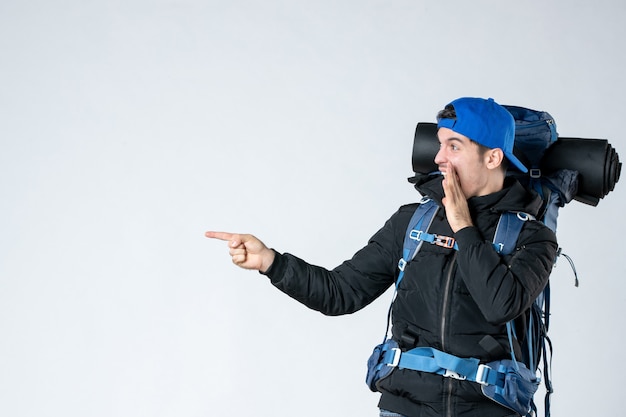 front view young male with backpack on white background mountain sky nature campaign forest air cold camp tent