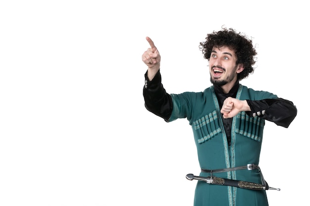 Front view of young man in traditional azerbaijani costume checking time on white background novruz concept spring ethnicity horizontal dancer performer colour