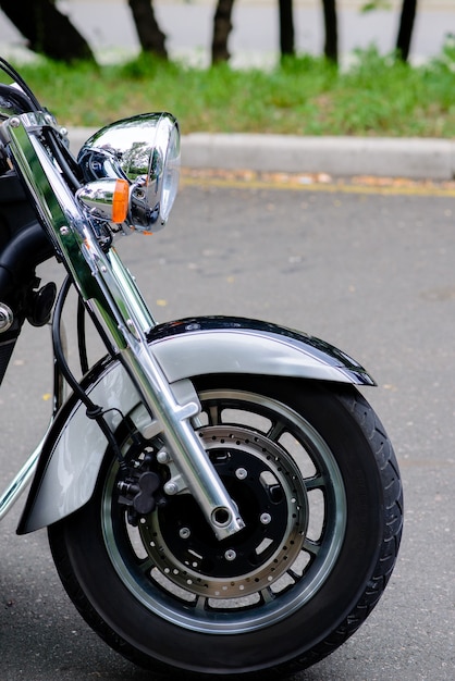 The front wheel of a motorcycle and headlamp