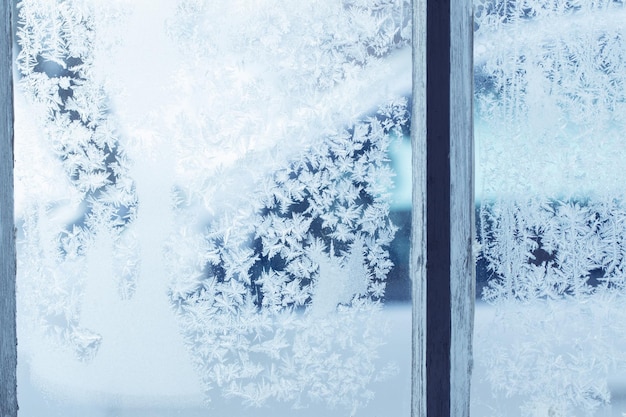 Photo frost on blue glass window background