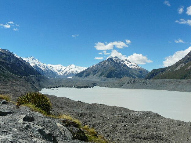 Frosted lake near volcanic mountains