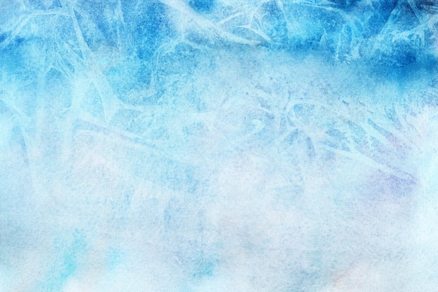 Photo frosted winter blue watercolor background painted on white paper