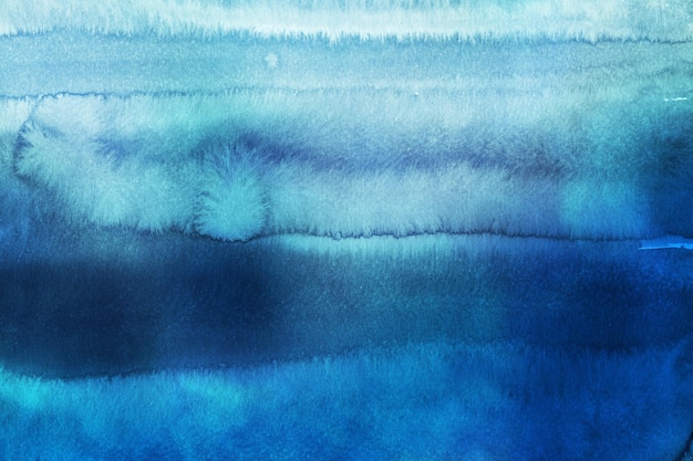 Photo frosted winter blue watercolor background painted on white paper