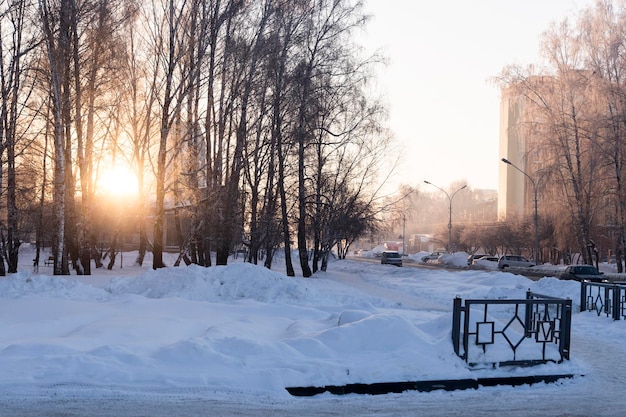 A frosty day on the streets of a winter city in the rays of sunlight