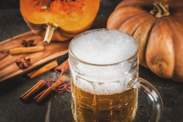 Frothy spicy pumpkin Ale or beer in glass mug