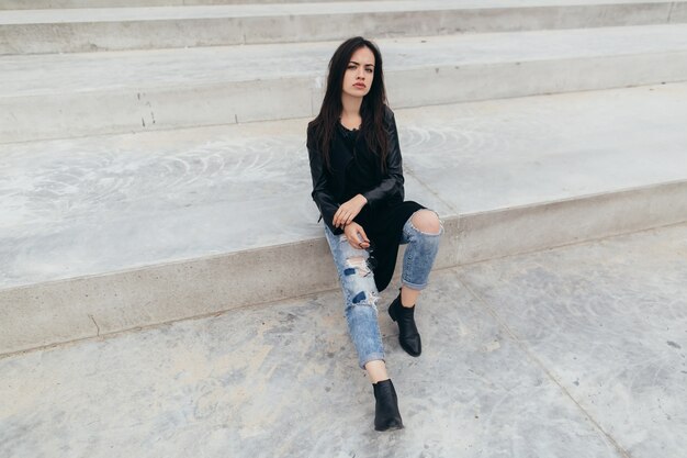 Frowning woman on stairs