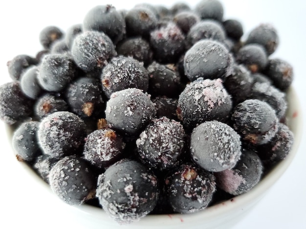 Frozen black currants in hoarfrost