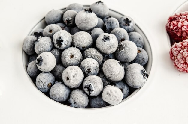 Frozen blueberries on a white background