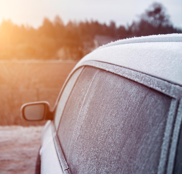 Frozen car at parking lot Frost on car windows frosted glass Frost on side car window