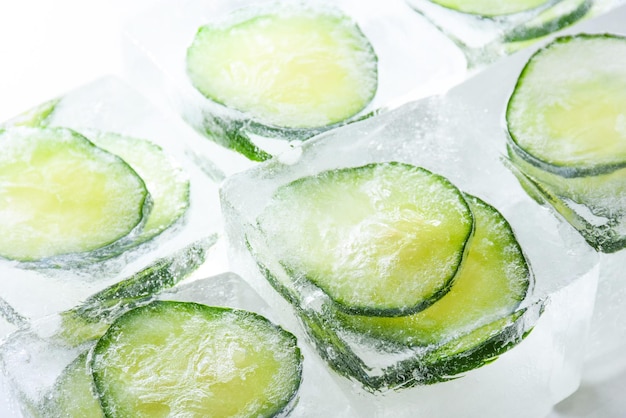 Frozen cucumber slices in the ice cubes