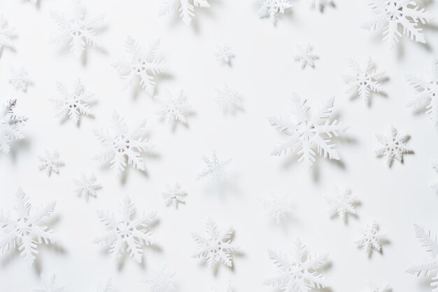 Frozen Elegance Exquisite Paper Snowflakes Unfolding on a Serene White Background and Design Space