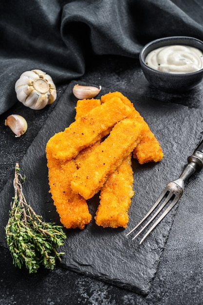 Frozen fish fingers on the table