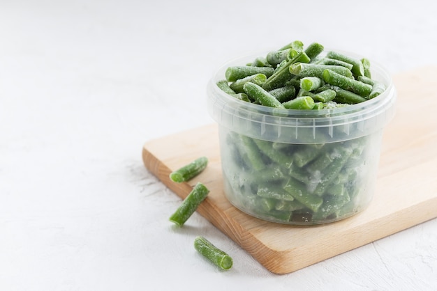 Frozen green beans in a container