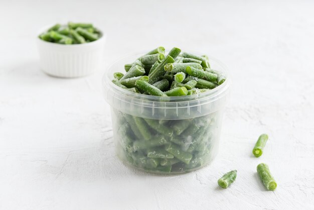 Frozen green beans in a container