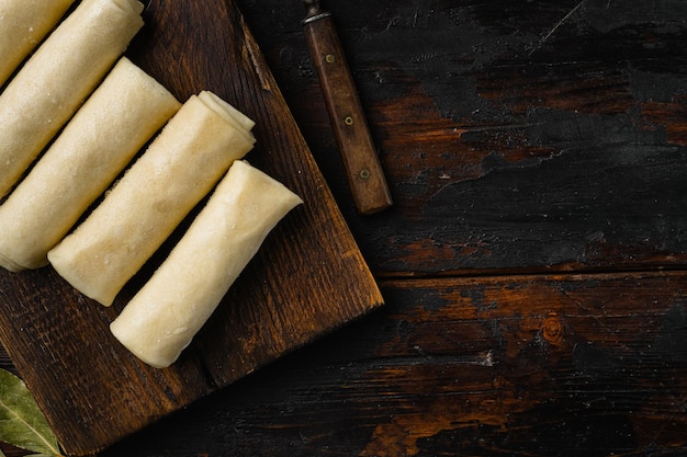 Frozen pancake stuffed on old dark wooden table background top view flat lay with copy space for text