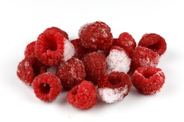 Frozen raspberries on a white background isolate