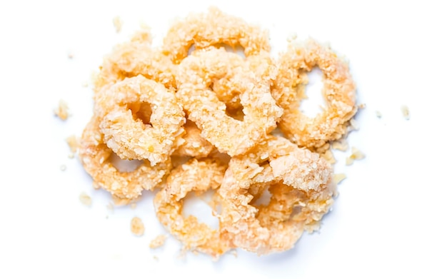 Frozen raw squid rings in breadcrumbs Isolated on white background