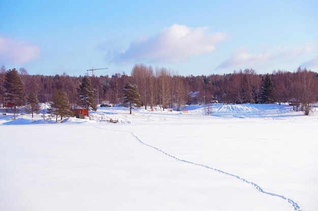 Frozen river with footprints on the snow in winter Rovaniemi, Lapland, Finland