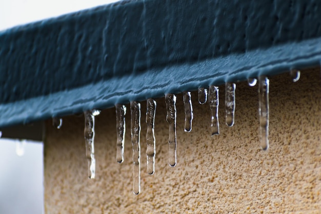 Frozen roof with small stalactites dark zincwork and light plaster