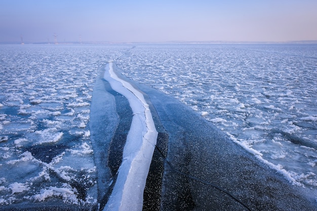 Frozen sea. Beautiful winter landscape with lake in morning time.