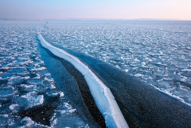 Frozen sea. Beautiful winter landscape with lake in morning time.