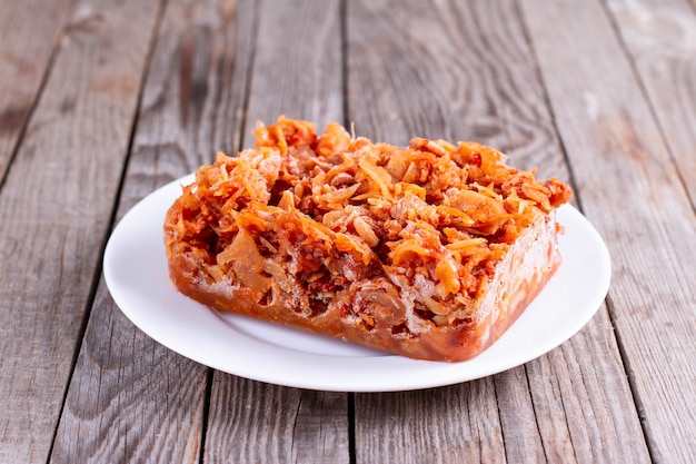 Frozen stewed cabbage on a plate. Frozen food, healthy food