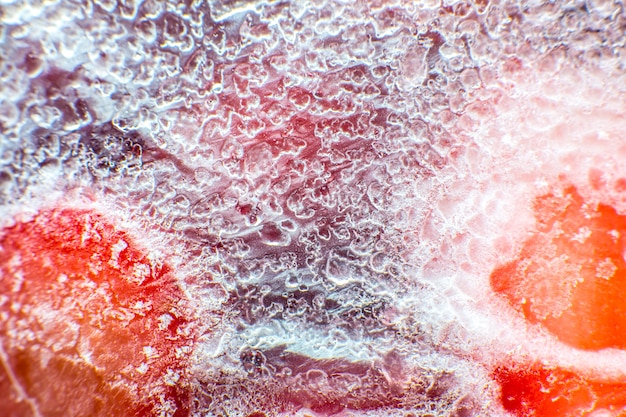 Frozen strawberries texture. close up. cold fruit in snow