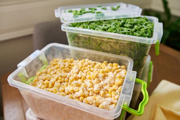 Frozen vegetables and fruits closeup frozen green onions corn