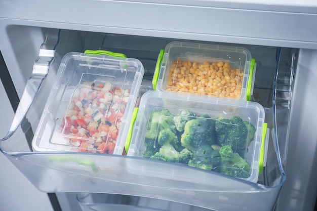 Frozen vegetables in refrigerator icebox