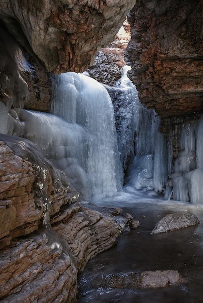 Frozen waterfall in a mountain gorge