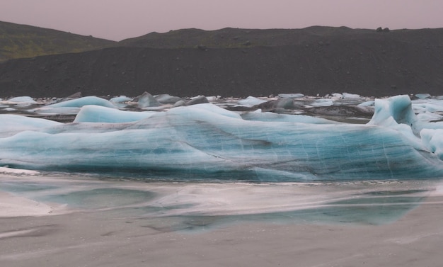 Frozen waves on northern lake landscape photo