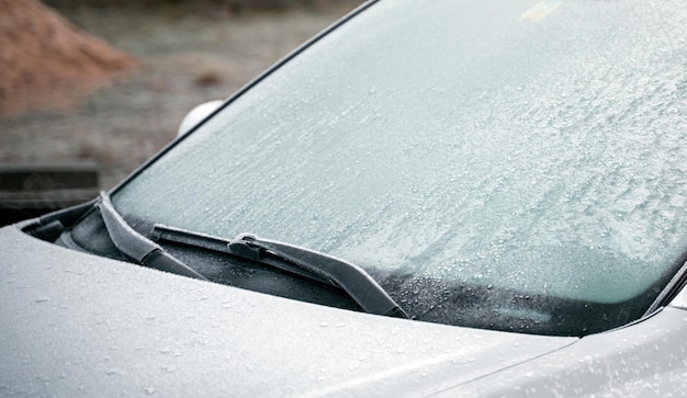 Frozen windshield wiper concept of dangerous driving during the winter season