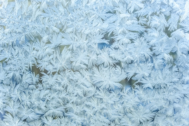 Photo frozen winter window with shiny ice frost texture