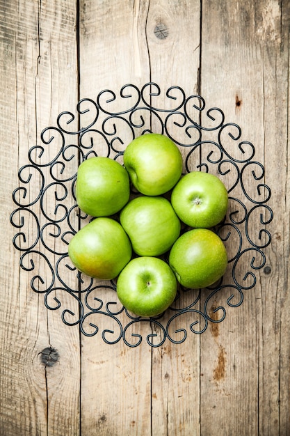 Fruit. apples in a bowl on wooden table