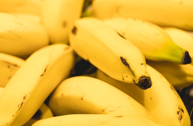 Fruit-banana on the bunch in close-up photography.