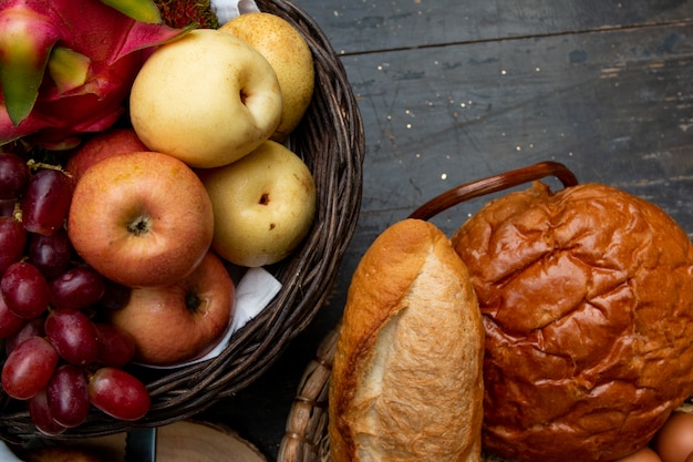 fruit basket and buns on breakfast table