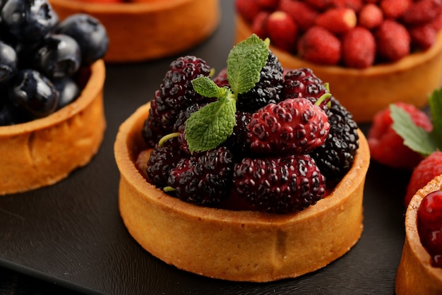 Fruit and berry tartlets dessert tray assorted.