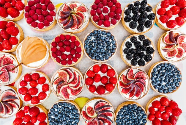 Fruit and berry tarts on a table