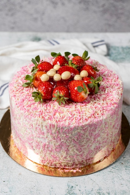 Fruit cake on a gray background Strawberry banana and chocolate birthday or celebration cake Bakery desserts vertical view close up