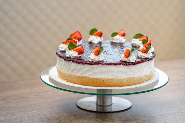 Fruit cake with marmalade and whipped cream